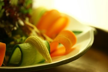 sliced cucumber on white ceramic plate