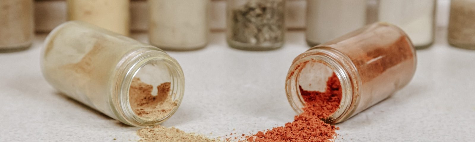 white powder in clear glass jars