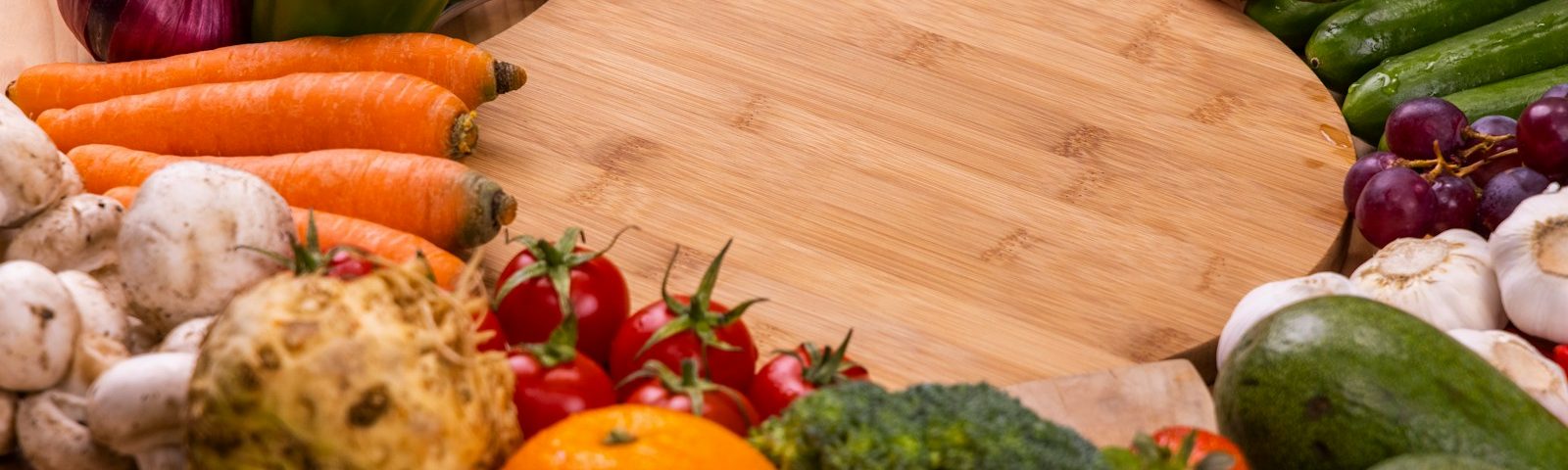 orange and green vegetables on brown wooden table