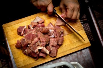 sliced meat on brown wooden chopping board